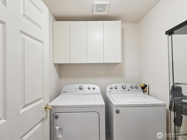 17581 110th Ln SE Unit 3, Renton, WA 98055 - laundry area with cabinet space and washing machine and clothes dryer