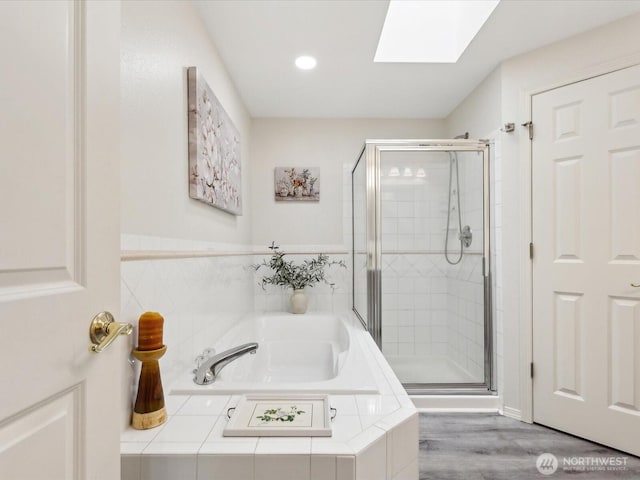 17581 110th Ln SE Unit 3, Renton, WA 98055 - bathroom with a skylight, a shower stall, a garden tub, recessed lighting, and wood finished floors