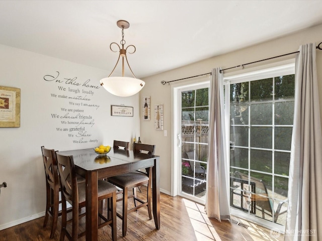 17581 110th Ln SE Unit 3, Renton, WA 98055 - dining area featuring baseboards and wood finished floors