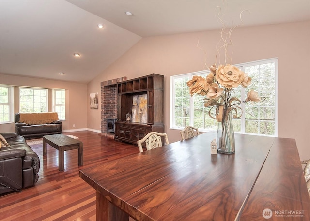 dining area with recessed lighting, lofted ceiling, baseboards, and dark wood-style flooring