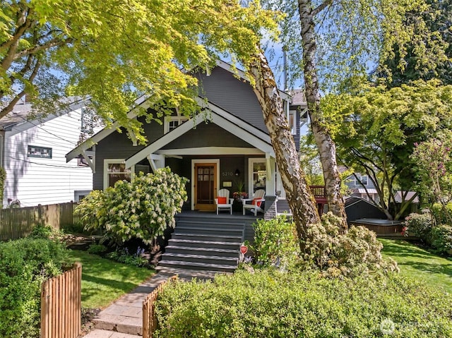 5210 35th Ave NE, Seattle, WA 98105 - view of property hidden behind natural elements with a porch