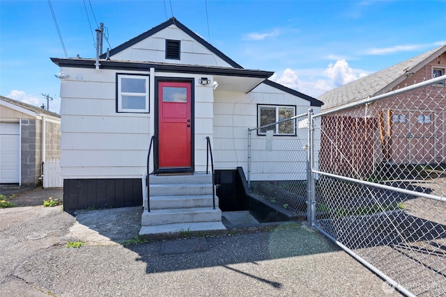view of front of property with fence and entry steps