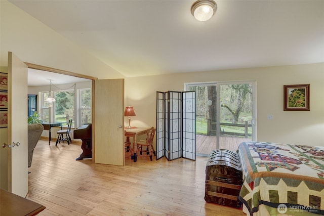 1319 Winlock Vader Rd Unit 19, Winlock, WA 98596 - bedroom featuring access to outside, multiple windows, light wood-style floors, and vaulted ceiling