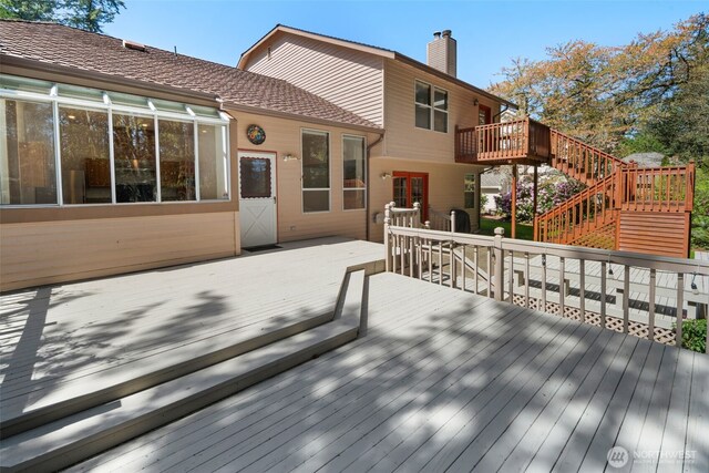 wooden terrace featuring stairway