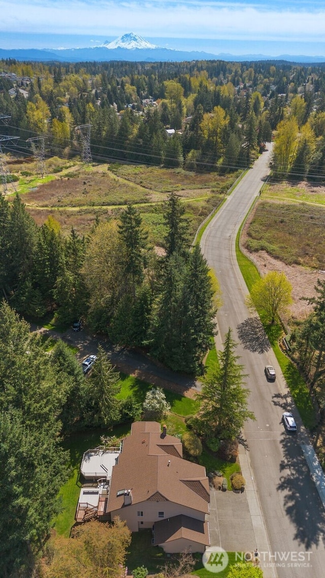 bird's eye view featuring a forest view