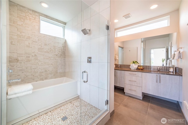 bathroom with recessed lighting, tile patterned floors, a shower stall, vanity, and visible vents