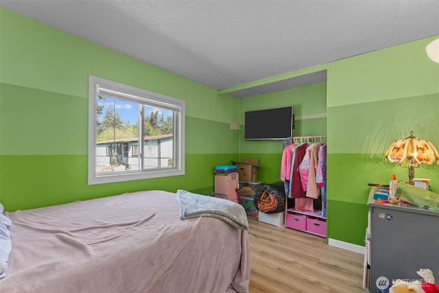 11519 21st Ave E Unit 84, Tacoma, WA 98445 - bedroom featuring wood finished floors