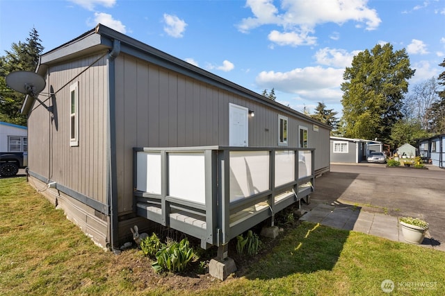 11519 21st Ave E Unit 84, Tacoma, WA 98445 - view of property exterior with a yard