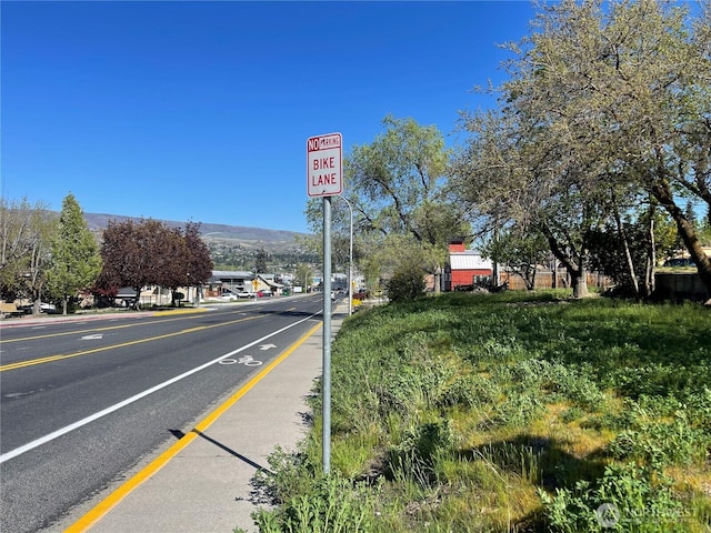 409 N Franklin Ave, Wenatchee, WA 98801 - view of asphalt road featuring traffic signs