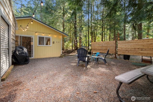 view of patio / terrace featuring a grill and fence