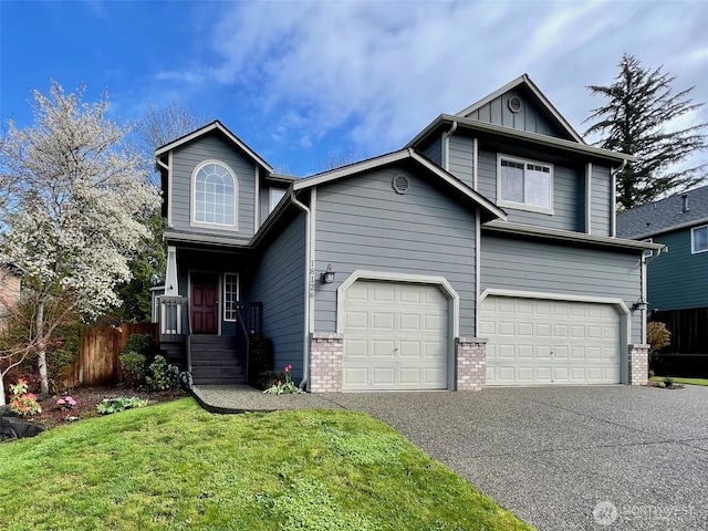 18126 SE 246th St, Covington, WA 98042 - view of front facade with a garage, driveway, a front lawn, and fence