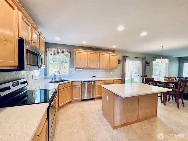 18126 SE 246th St, Covington, WA 98042 - kitchen featuring a wealth of natural light, a sink, recessed lighting, and appliances with stainless steel finishes