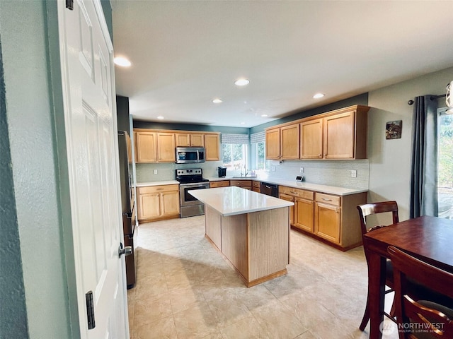 18126 SE 246th St, Covington, WA 98042 - kitchen featuring a sink, light countertops, appliances with stainless steel finishes, a kitchen island, and recessed lighting