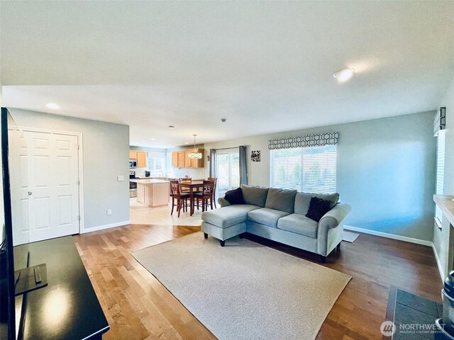 18126 SE 246th St, Covington, WA 98042 - living room with recessed lighting, wood finished floors, and baseboards