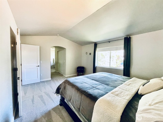 18126 SE 246th St, Covington, WA 98042 - carpeted bedroom with vaulted ceiling, baseboards, and arched walkways