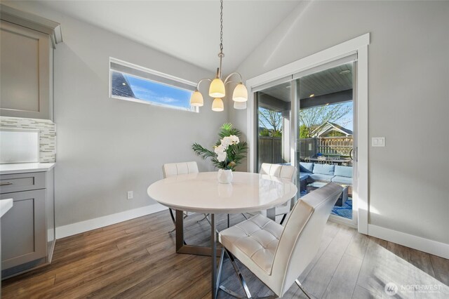 308 Chardonnay Ct, Walla Walla, WA 99362 - dining room with vaulted ceiling, baseboards, a notable chandelier, and dark wood-type flooring