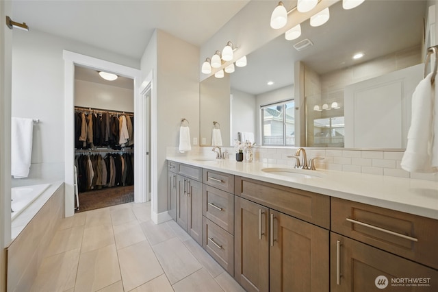 308 Chardonnay Ct, Walla Walla, WA 99362 - bathroom with tasteful backsplash, double vanity, tile patterned flooring, and a sink
