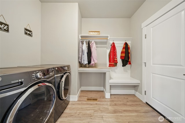 308 Chardonnay Ct, Walla Walla, WA 99362 - clothes washing area featuring light wood-style flooring, washing machine and clothes dryer, baseboards, and laundry area
