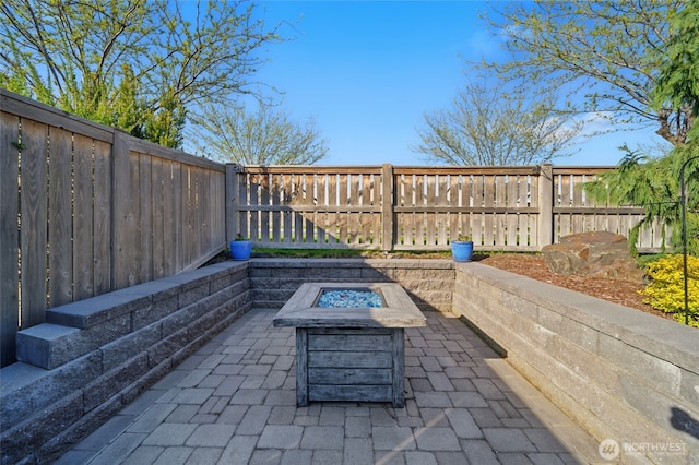 308 Chardonnay Ct, Walla Walla, WA 99362 - view of patio with a fenced backyard and an outdoor fire pit