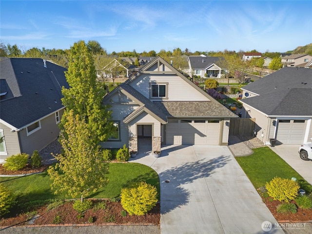 308 Chardonnay Ct, Walla Walla, WA 99362 - view of front facade featuring a residential view, concrete driveway, a garage, a shingled roof, and a front yard