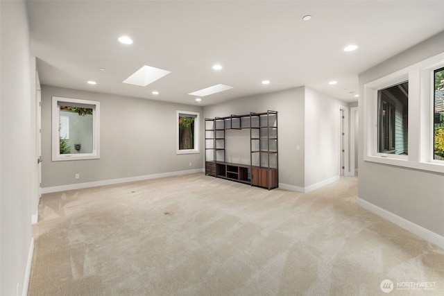 4229 95th Ave NE, Yarrow Point, WA 98004 - spare room with recessed lighting, baseboards, carpet flooring, and a skylight