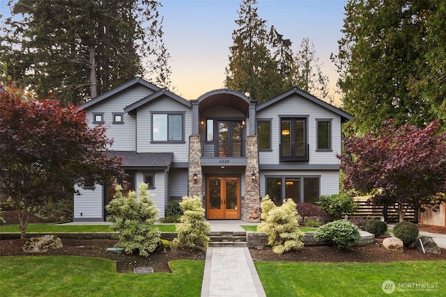 4229 95th Ave NE, Yarrow Point, WA 98004 - view of front of property with fence, french doors, a front yard, and a balcony