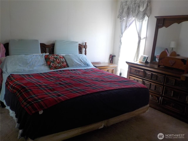 bedroom featuring carpet