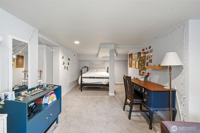 bedroom with baseboards and light colored carpet