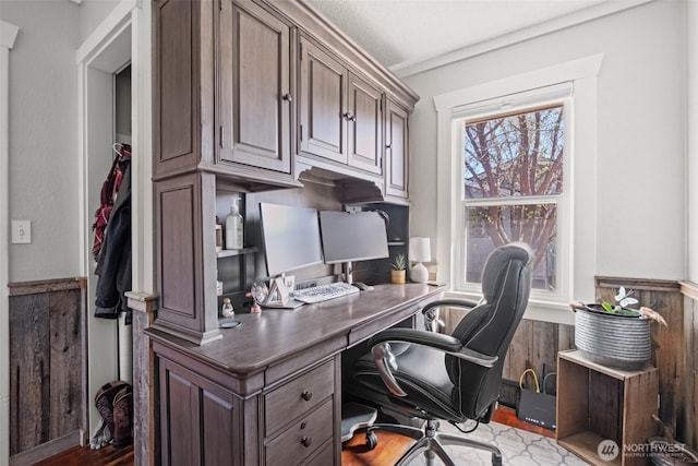 office space with wainscoting and wood finished floors