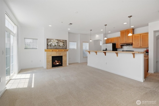 10757 NE Red Wing Way Unit 201, Hillsboro, OR 97006 - unfurnished living room with light colored carpet, recessed lighting, and a fireplace