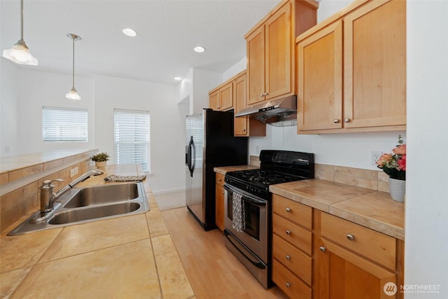 10757 NE Red Wing Way Unit 201, Hillsboro, OR 97006 - kitchen featuring stainless steel appliances, under cabinet range hood, hanging light fixtures, light countertops, and recessed lighting