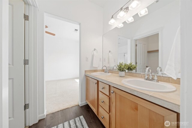 10757 NE Red Wing Way Unit 201, Hillsboro, OR 97006 - bathroom featuring double vanity and wood finished floors