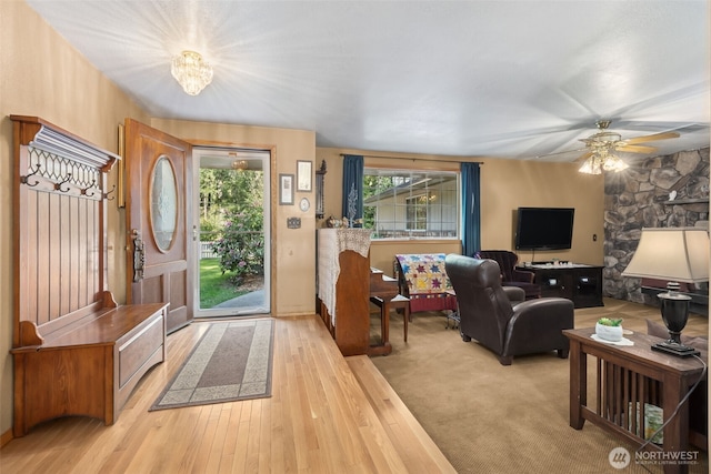 entryway with ceiling fan and light wood-style floors