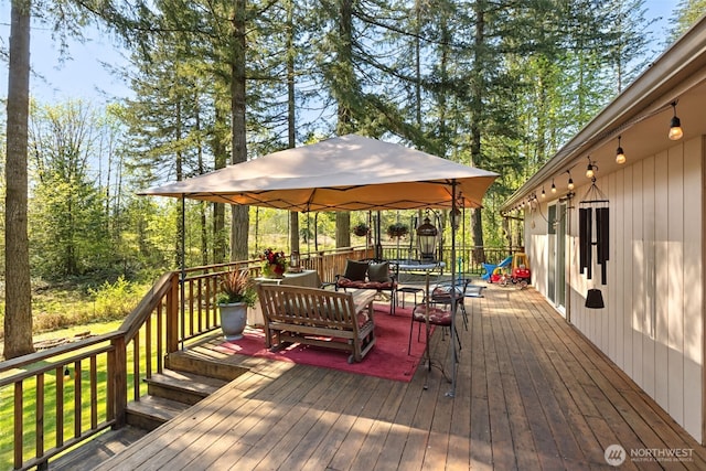 deck featuring a gazebo and an outdoor hangout area