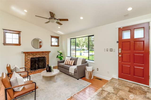 living area featuring recessed lighting, lofted ceiling, baseboards, light wood-style flooring, and ceiling fan
