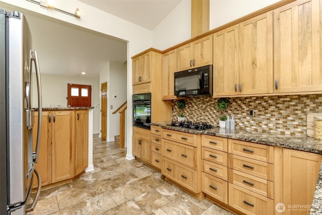 kitchen with tasteful backsplash, dark stone countertops, black appliances, light brown cabinetry, and recessed lighting