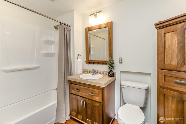 full bath with toilet, vanity, and shower / bathtub combination with curtain
