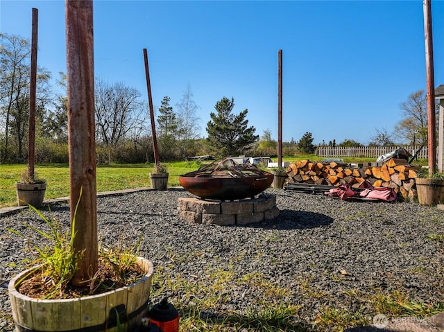 view of yard with a fire pit