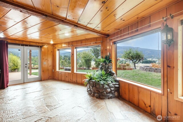 sunroom / solarium with plenty of natural light and french doors