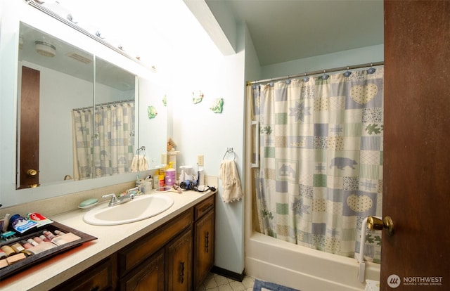 bathroom featuring vanity and shower / bath combination with curtain