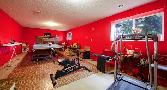 playroom featuring a textured ceiling