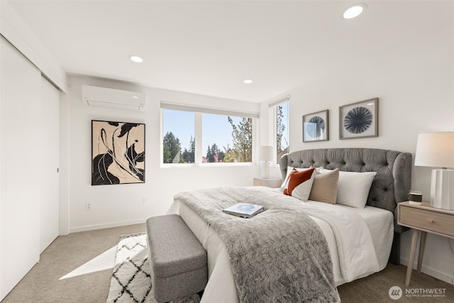 carpeted bedroom featuring baseboards, recessed lighting, and a wall unit AC