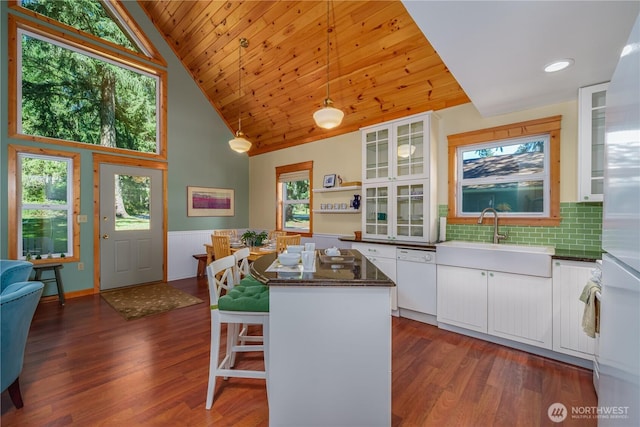 12916 91st Street Ct, Anderson Island, WA 98303 - kitchen featuring white cabinets, a center island, white dishwasher, and a sink