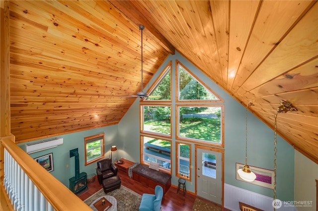 12916 91st Street Ct, Anderson Island, WA 98303 - living room featuring wood ceiling, lofted ceiling, wood finished floors, and baseboards