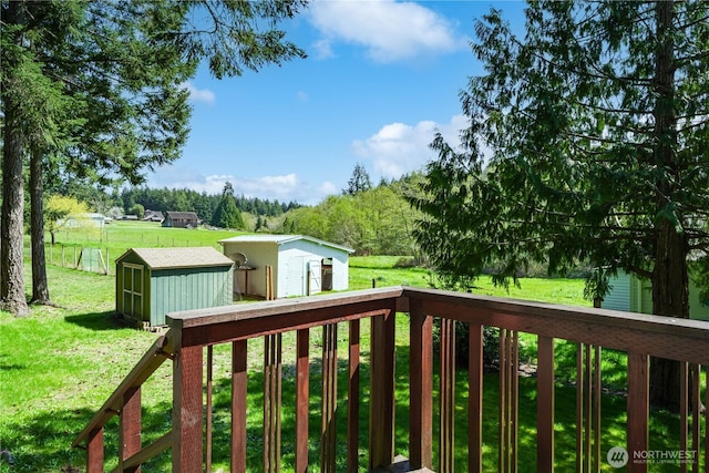 12916 91st Street Ct, Anderson Island, WA 98303 - wooden deck featuring an outbuilding, a yard, and a storage shed