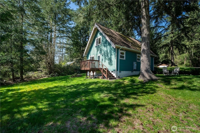 12916 91st Street Ct, Anderson Island, WA 98303 - back of property with a wooden deck, a yard, stairs, and crawl space