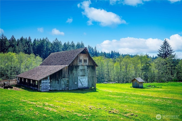 12916 91st Street Ct, Anderson Island, WA 98303 - view of barn featuring a lawn and a forest view