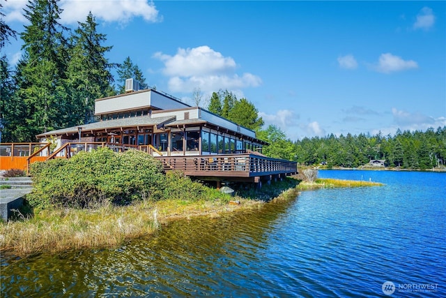 12916 91st Street Ct, Anderson Island, WA 98303 - view of dock with a deck with water view and a view of trees