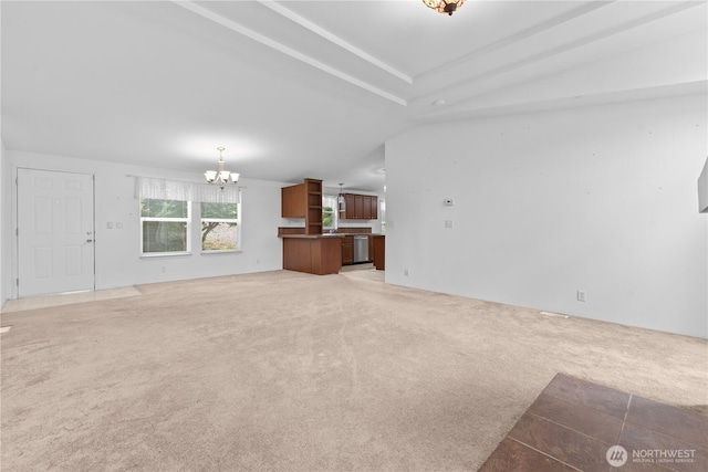 23914 66th St E Unit 33, Buckley, WA 98391 - unfurnished living room featuring a chandelier and light carpet
