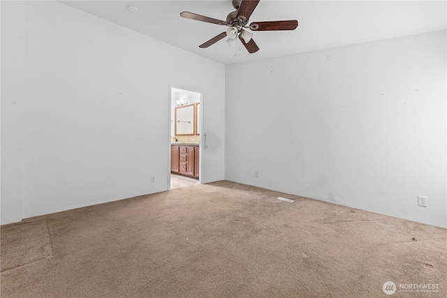 23914 66th St E Unit 33, Buckley, WA 98391 - spare room featuring light carpet and a ceiling fan